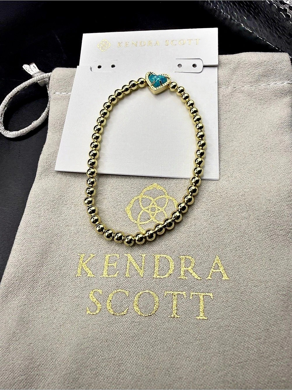 Kendra Scott Mini Elaina Gold Stretch Bracelet with teal heart